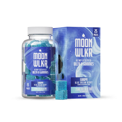 A bottle and box of MoonWlkr Blue Dream Delta 8 gummies. Two gummies sit outside the bottle and are blue and sparkly.