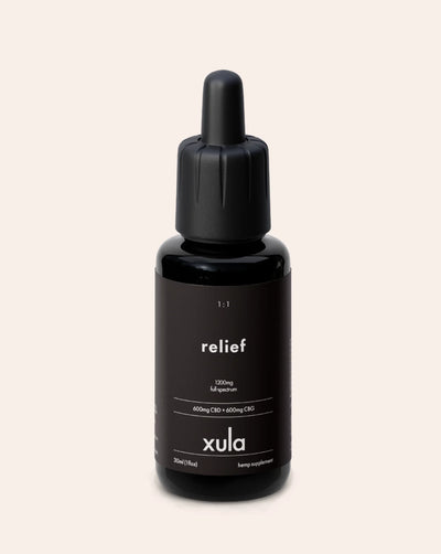 A tincture bottle of Xula Solo Hemp Relief Tincture oil with 1:1 CBD and CBG. This oil is strong and good for pain or muscle recovery.